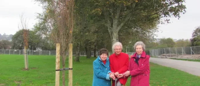 The final commemorative tree was planted by three ladies